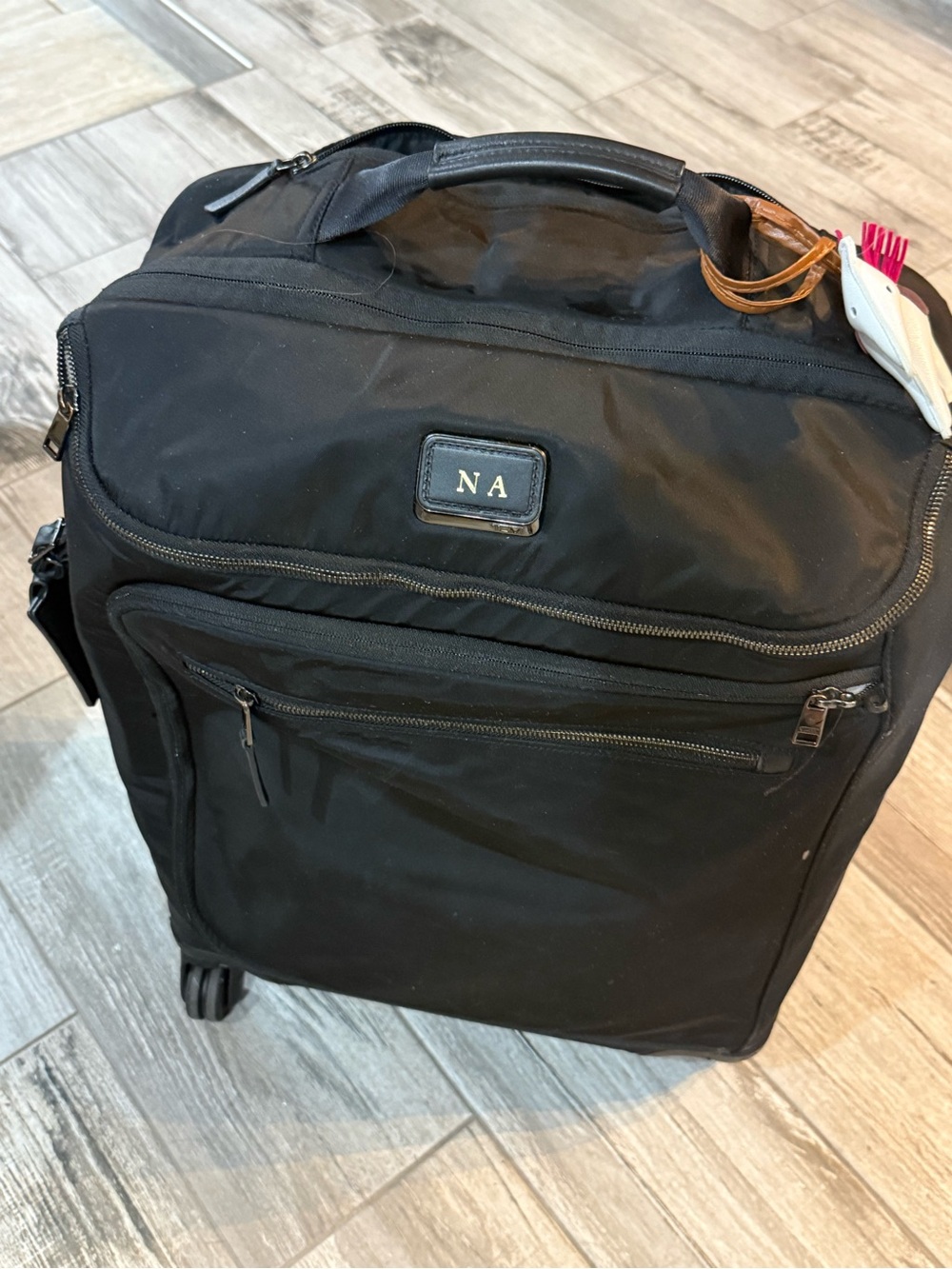 Tumi Black Rolling Carry-On with Front Zip Pocket